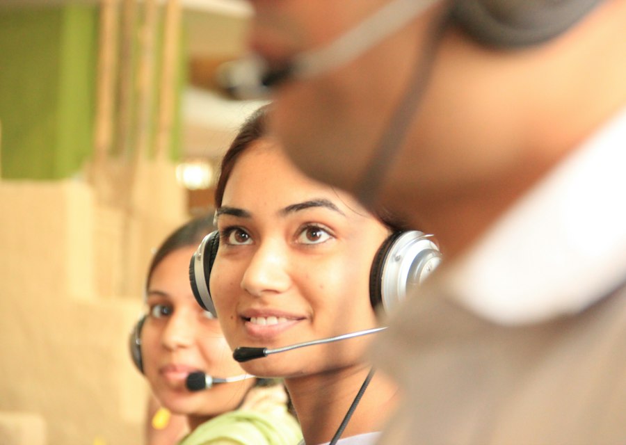 Dispatcher wearing a headset at a workstation